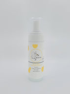 Bee Vee Clean white foaming cleanser bottle with yellow accents. Unscented, plant-based, paraben and sulfate-free.